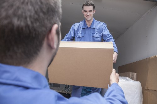 Movers loading household items for a Crayford home move