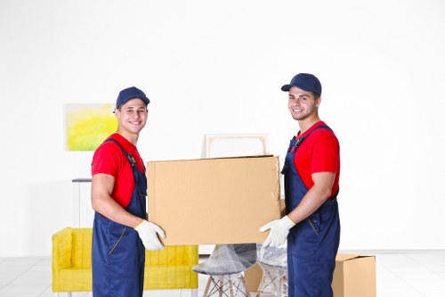Household moving boxes and furniture prepared for a home move in Crayford