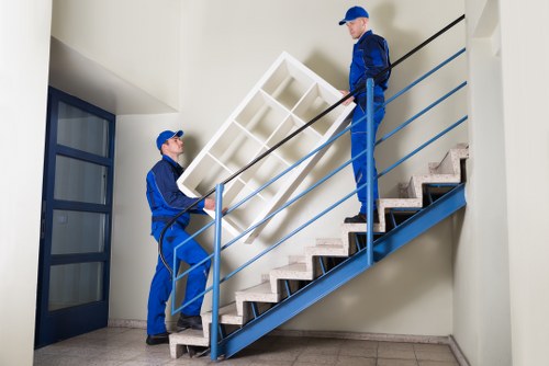 Ongoing safety checks and protective gear used by a Crayford moving team
