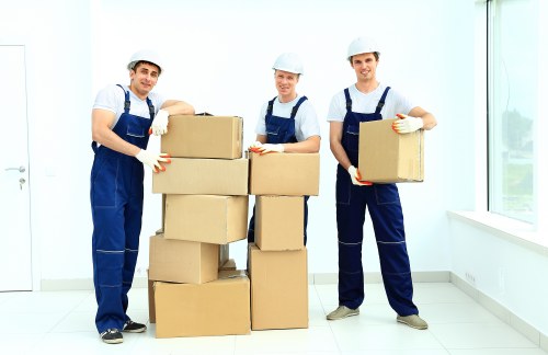Packed moving boxes and furniture ready for transport in Crayford