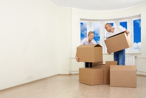 Boxes and furniture being unloaded at a new Crayford home