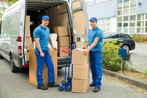 Local movers handling furniture during a house removal in Crayford