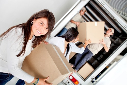 Packed boxes and furniture prepared for a local move in Crayford